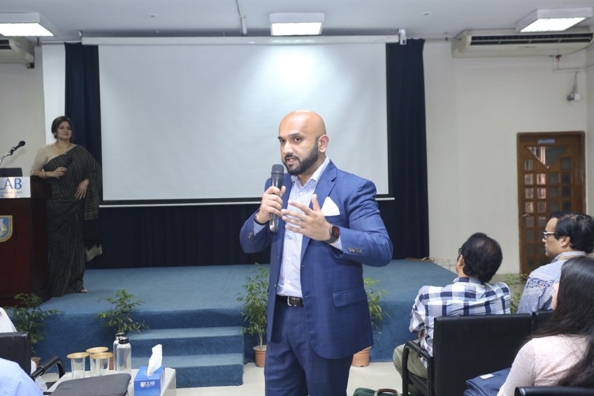 Mr. Sajir speaking at an event