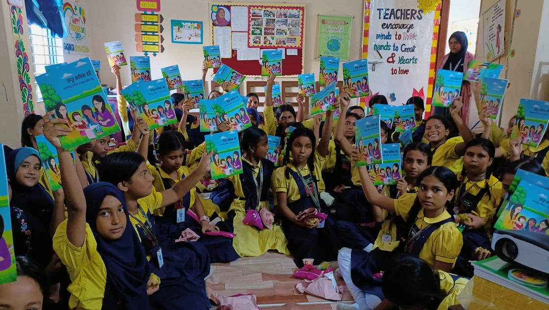 Students at a school showing their Wreetu comic book