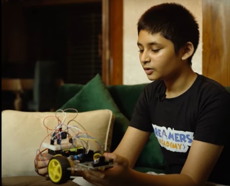 A Dreamers student deep in experimenting